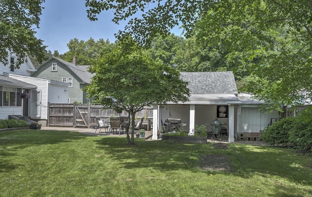 67 Pine Ave, Keene, NH 03431 - rear view of house featuring a patio area and roof with shingles
