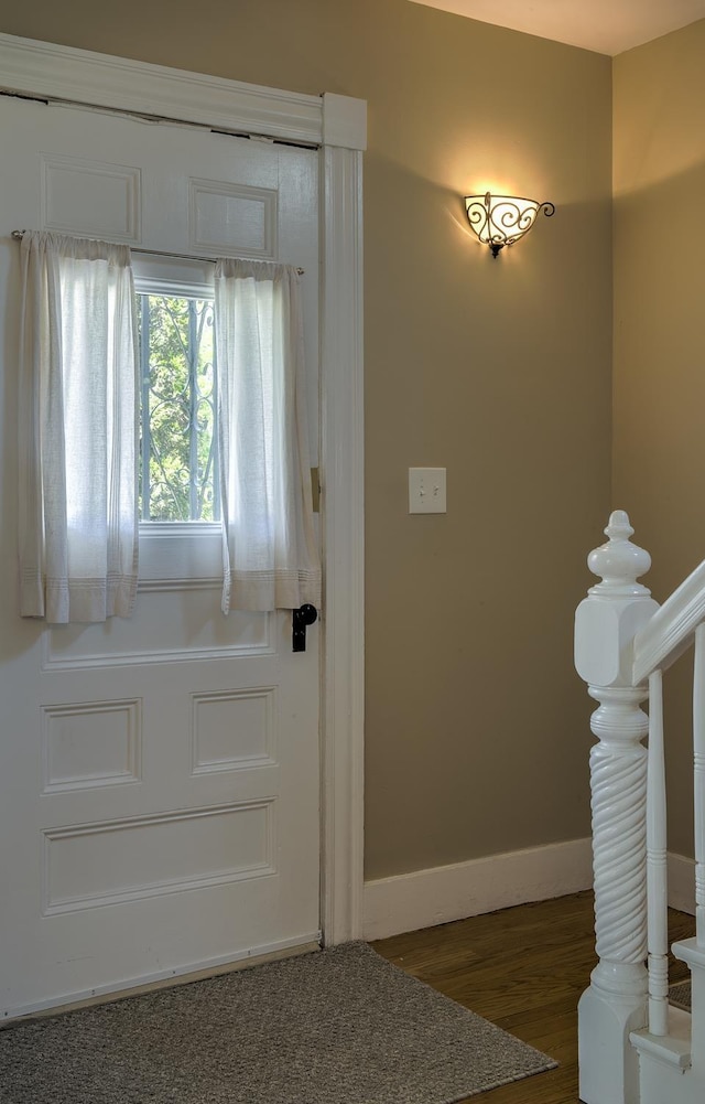 67 Pine Ave, Keene, NH 03431 - doorway to outside with wood finished floors and baseboards
