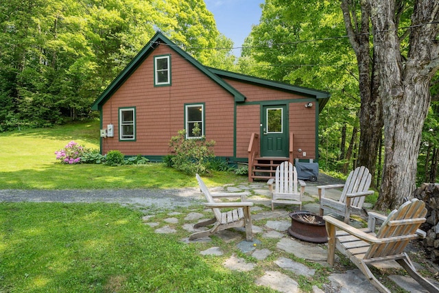450 Ryan Rd, Duxbury, VT 05676 - back of property featuring a fire pit, a yard, and entry steps