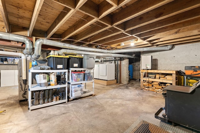450 Ryan Rd, Duxbury, VT 05676 - unfinished basement featuring a water pressure tank, washer and dryer, and water heater