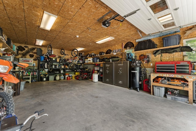 450 Ryan Rd, Duxbury, VT 05676 - garage featuring a workshop area and a garage door opener