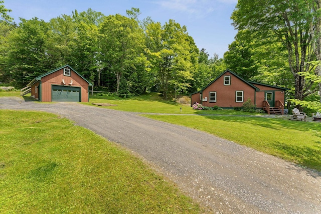 450 Ryan Rd, Duxbury, VT 05676 - view of front facade featuring an outdoor structure, a garage, entry steps, and a front yard