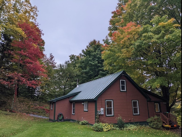 450 Ryan Rd, Duxbury, VT 05676 - view of home's exterior with a lawn, a standing seam roof, and a metal roof