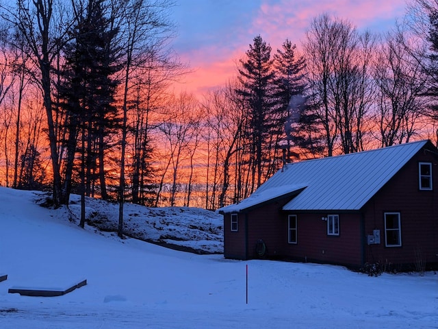 450 Ryan Rd, Duxbury, VT 05676 - view of snow covered exterior with a metal roof and a standing seam roof