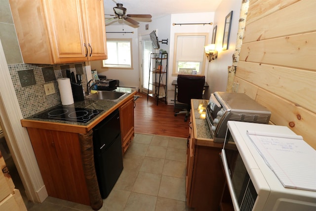 79 Huckleberry Ln Unit 19, Warren, VT 05674 - kitchen featuring tasteful backsplash, a ceiling fan, black electric stovetop, and light tile patterned flooring