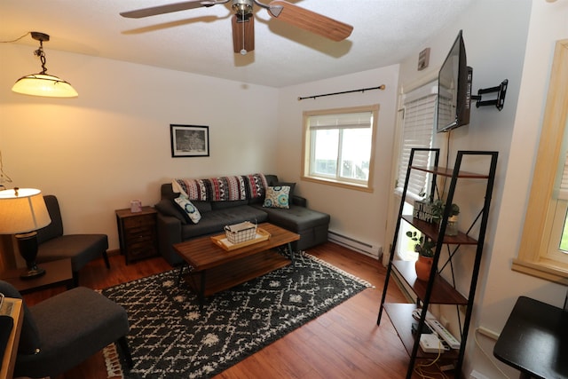 79 Huckleberry Ln Unit 19, Warren, VT 05674 - living room with baseboard heating, ceiling fan, and wood finished floors