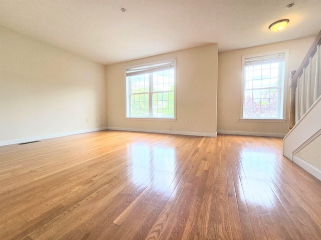 69 Mulberry St Unit 3, Concord, NH 03301 - unfurnished room with healthy amount of natural light, wood finished floors, and stairs
