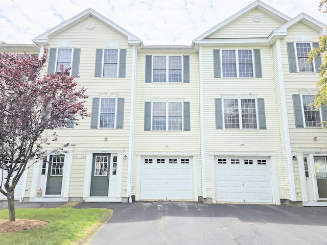 69 Mulberry St Unit 3, Concord, NH 03301 - view of property featuring driveway and a garage