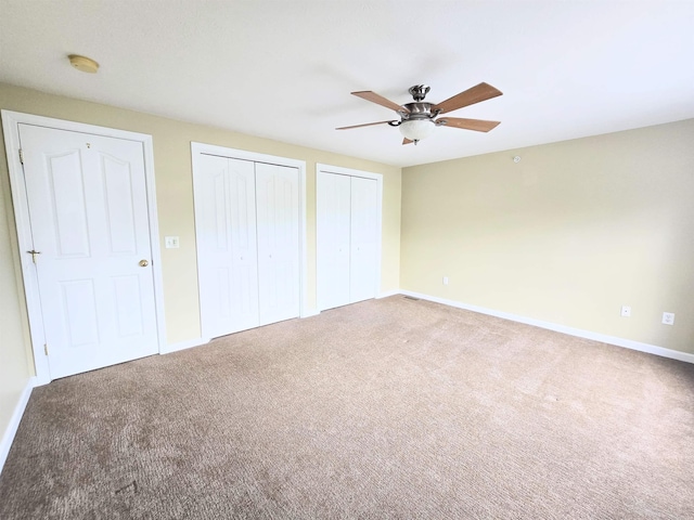 69 Mulberry St Unit 3, Concord, NH 03301 - unfurnished bedroom with multiple closets, carpet flooring, and ceiling fan