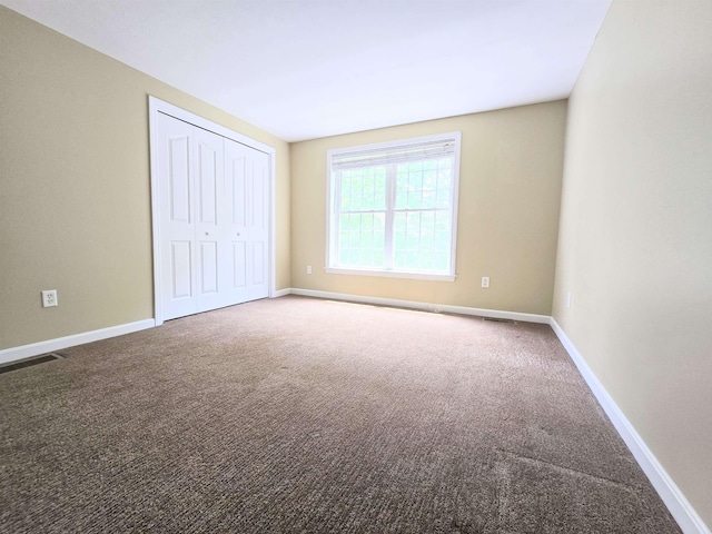 69 Mulberry St Unit 3, Concord, NH 03301 - unfurnished bedroom with carpet floors and a closet