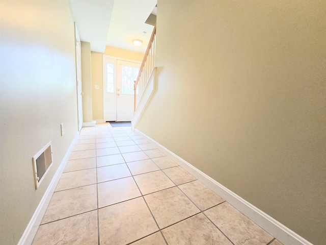 69 Mulberry St Unit 3, Concord, NH 03301 - doorway with light tile patterned flooring and stairs