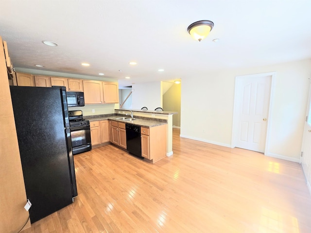 69 Mulberry St Unit 3, Concord, NH 03301 - kitchen featuring black appliances, light brown cabinets, a peninsula, light wood finished floors, and recessed lighting