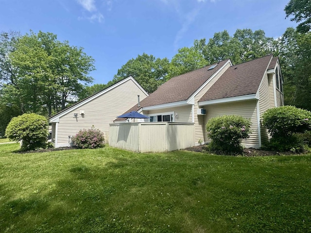 68 Franklin Hts, Rochester, NH 03867 - view of side of home with roof with shingles and a lawn