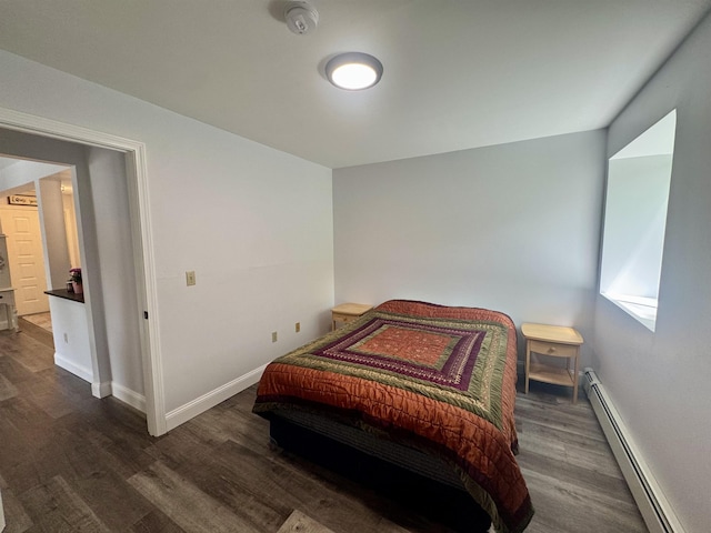 68 Franklin Hts, Rochester, NH 03867 - bedroom featuring a baseboard radiator and dark wood-style flooring