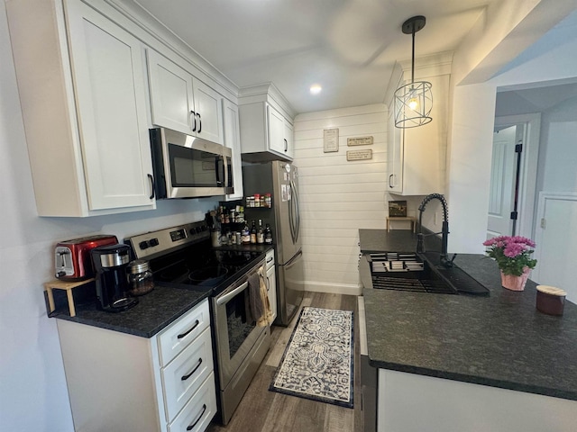 68 Franklin Hts, Rochester, NH 03867 - kitchen with stainless steel appliances, dark countertops, white cabinetry, dark wood finished floors, and recessed lighting