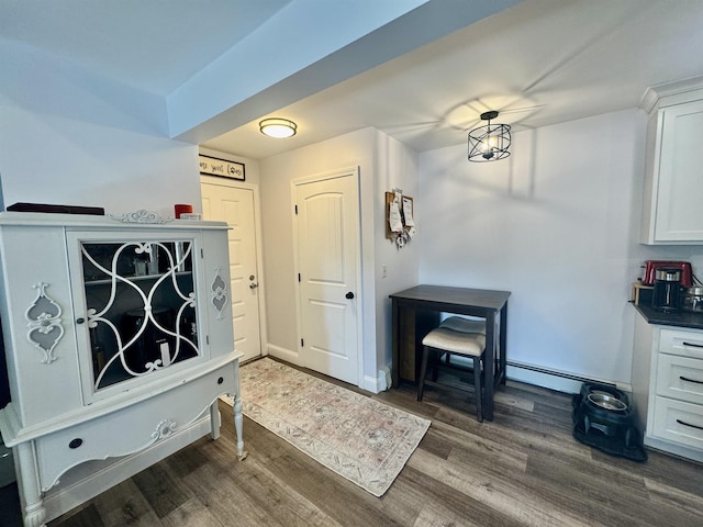68 Franklin Hts, Rochester, NH 03867 - foyer featuring a baseboard radiator and dark wood-style flooring