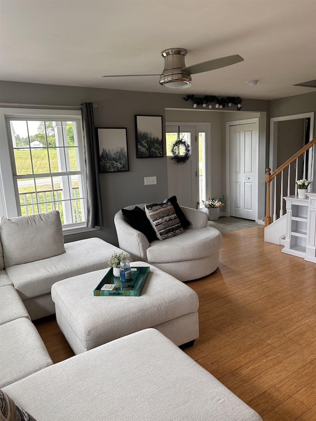 81 Cider St, Epping, NH 03042 - living area with stairs, ceiling fan, and wood finished floors