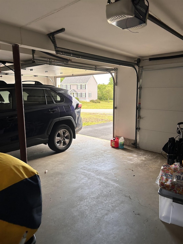 81 Cider St, Epping, NH 03042 - garage featuring a garage door opener