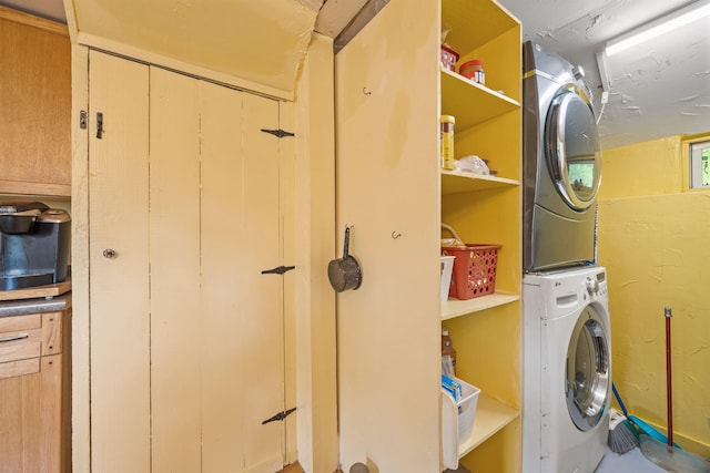 236 N Main St, Franklin, NH 03235 - laundry room featuring stacked washer / dryer