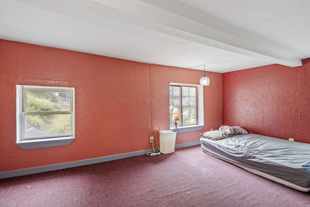 236 N Main St, Franklin, NH 03235 - carpeted bedroom featuring a textured wall and baseboards
