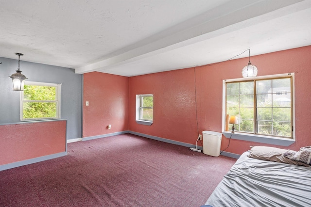 236 N Main St, Franklin, NH 03235 - unfurnished bedroom with multiple windows, carpet floors, a textured wall, beamed ceiling, and a textured ceiling