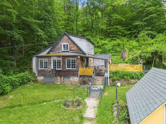 236 N Main St, Franklin, NH 03235 - view of front of house with a front yard and a wooded view