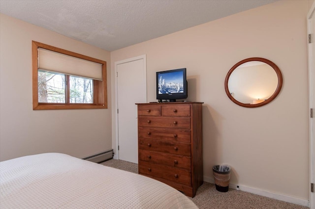 36 Lower Iv Unit 48A, Ludlow, VT 05149 - bedroom with a baseboard radiator and carpet