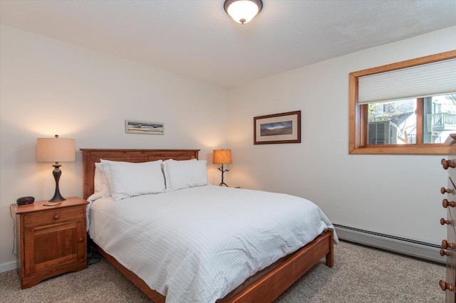 36 Lower Iv Unit 48A, Ludlow, VT 05149 - bedroom with a baseboard radiator and light colored carpet
