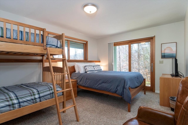 36 Lower Iv Unit 48A, Ludlow, VT 05149 - bedroom with multiple windows, carpet floors, and access to outside
