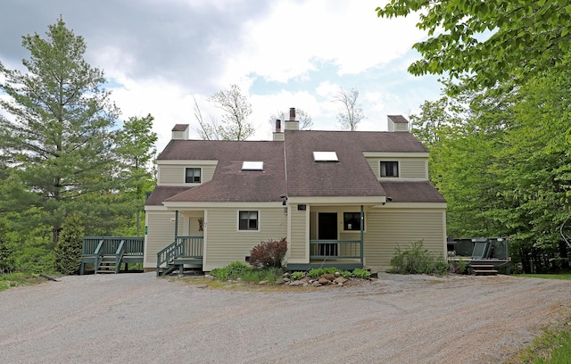 36 Lower Iv Unit 48A, Ludlow, VT 05149 - view of front of property featuring a shingled roof, a chimney, and driveway