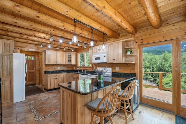 203 Orris Rd, Thornton, NH 03285 - kitchen with white appliances, a peninsula, open shelves, glass insert cabinets, and a kitchen bar