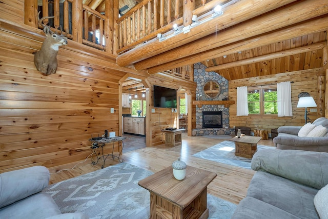 203 Orris Rd, Thornton, NH 03285 - living area featuring hardwood / wood-style flooring, a fireplace, and log walls