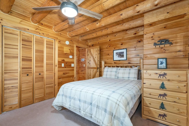 203 Orris Rd, Thornton, NH 03285 - bedroom with carpet flooring, a wooden ceiling with exposed beams, wood walls, and a closet