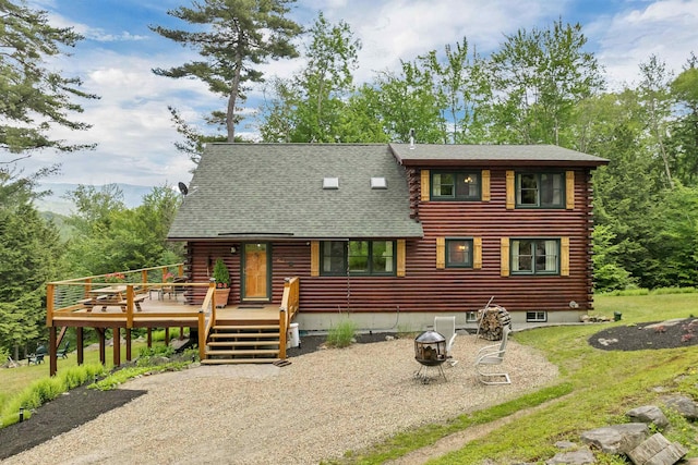 203 Orris Rd, Thornton, NH 03285 - view of front of house featuring an outdoor fire pit, a wooden deck, log siding, and a shingled roof