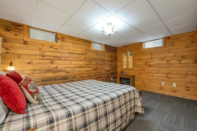 203 Orris Rd, Thornton, NH 03285 - carpeted bedroom with a paneled ceiling and wooden walls