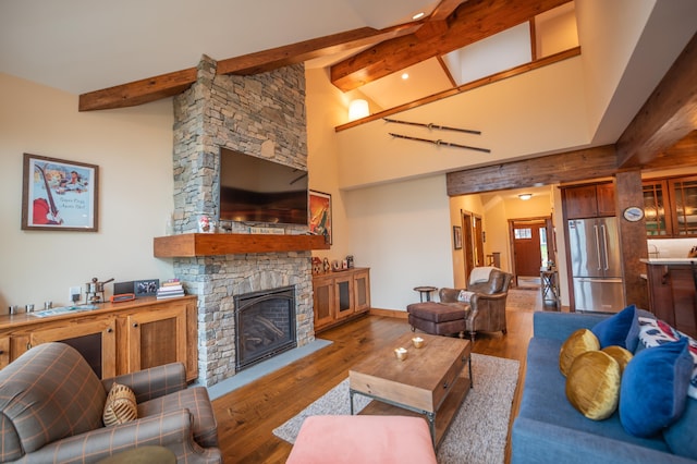 3B Freestyle Cir, Dover, VT 05356 - living room with wood finished floors and a stone fireplace