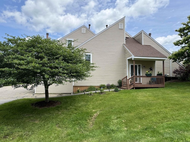 501 Bean Hill Rd Unit 32, Northfield, NH 03276 - view of side of property with a wooden deck, a yard, and roof with shingles