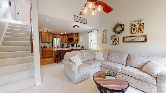 501 Bean Hill Rd Unit 32, Northfield, NH 03276 - living area with stairs, light carpet, a chandelier, and recessed lighting