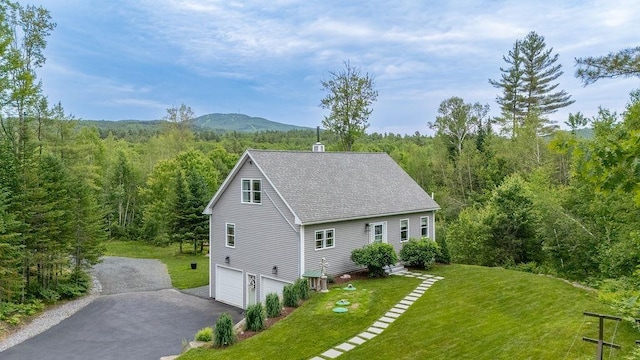 52 Jeffrey Dr, Sunapee, NH 03782 - view of property exterior featuring a view of trees, a yard, driveway, and a shingled roof
