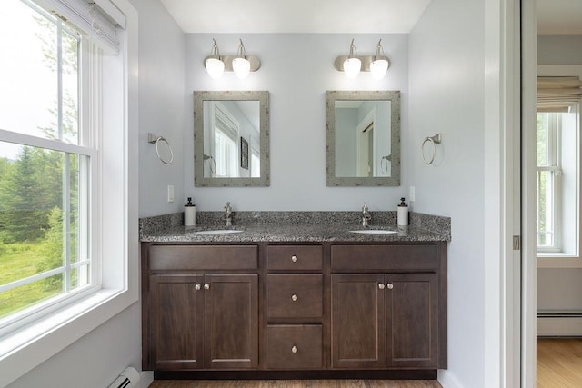 52 Jeffrey Dr, Sunapee, NH 03782 - full bath with baseboard heating, healthy amount of natural light, and a baseboard radiator