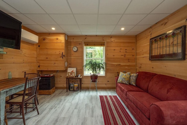 52 Jeffrey Dr, Sunapee, NH 03782 - living area featuring wood finished floors, a drop ceiling, wooden walls, an AC wall unit, and recessed lighting