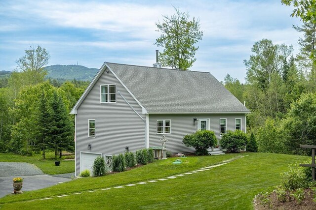 52 Jeffrey Dr, Sunapee, NH 03782 - view of home's exterior featuring a lawn, roof with shingles, an attached garage, driveway, and a mountain view