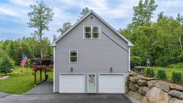 52 Jeffrey Dr, Sunapee, NH 03782 - view of side of home with asphalt driveway, a garage, a lawn, and a wooden deck