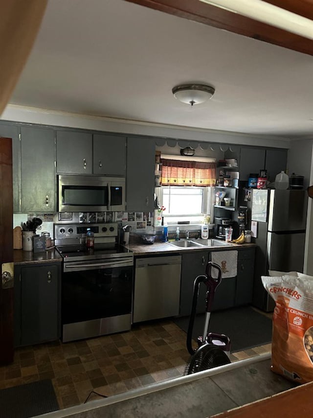 33 Salmon Falls Rd, Rochester, NH 03868 - kitchen with stainless steel appliances, gray cabinets, and dark countertops