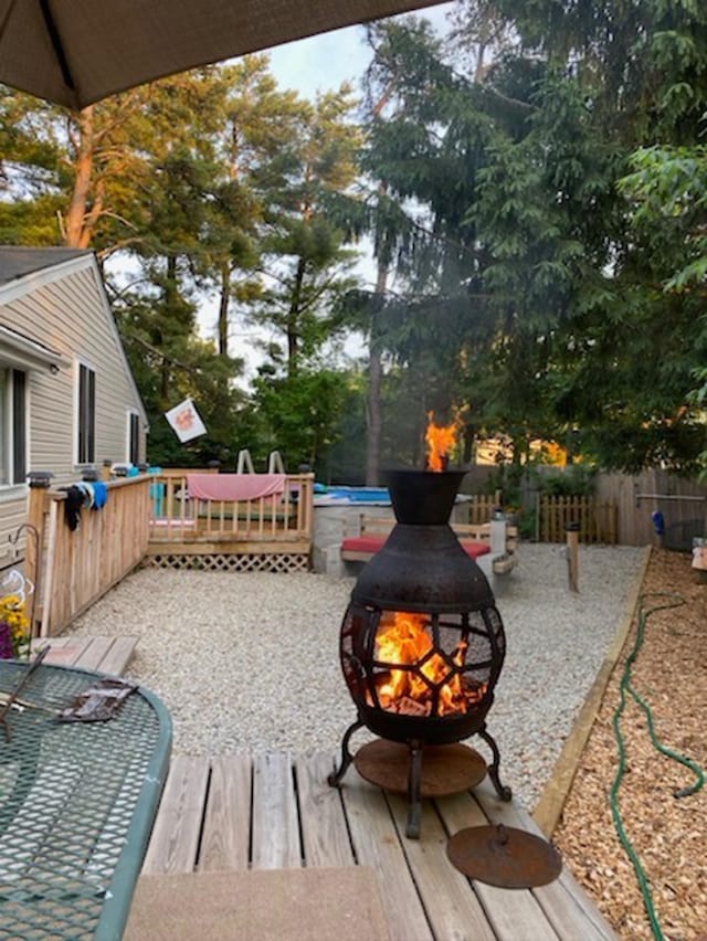 33 Salmon Falls Rd, Rochester, NH 03868 - view of patio / terrace with an outdoor fire pit and a wooden deck