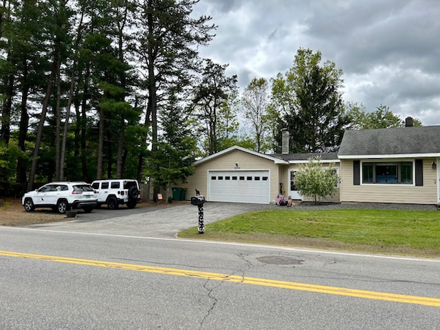 33 Salmon Falls Rd, Rochester, NH 03868 - ranch-style home with a chimney, a garage, a front lawn, and asphalt driveway