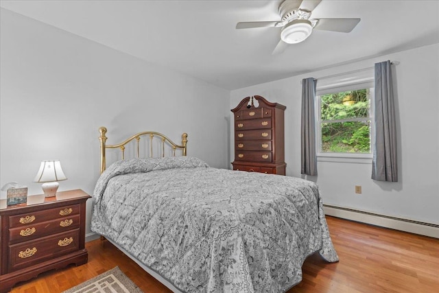 89 Catella Rd, Essex, VT 05452 - bedroom with a baseboard heating unit, wood finished floors, and a ceiling fan