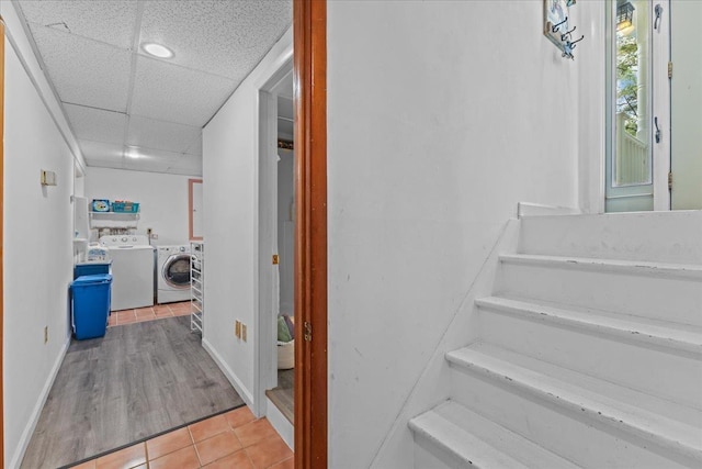 89 Catella Rd, Essex, VT 05452 - stairway with washer and clothes dryer, tile patterned floors, and a drop ceiling