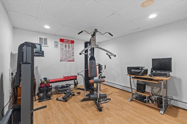 89 Catella Rd, Essex, VT 05452 - workout area with wood finished floors, recessed lighting, a paneled ceiling, and a baseboard radiator