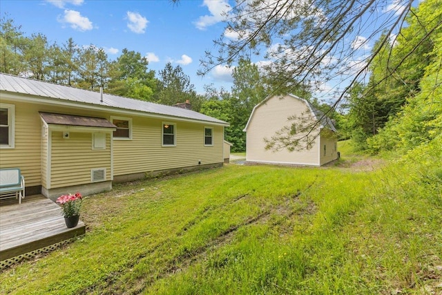 89 Catella Rd, Essex, VT 05452 - view of green lawn featuring a wooden deck